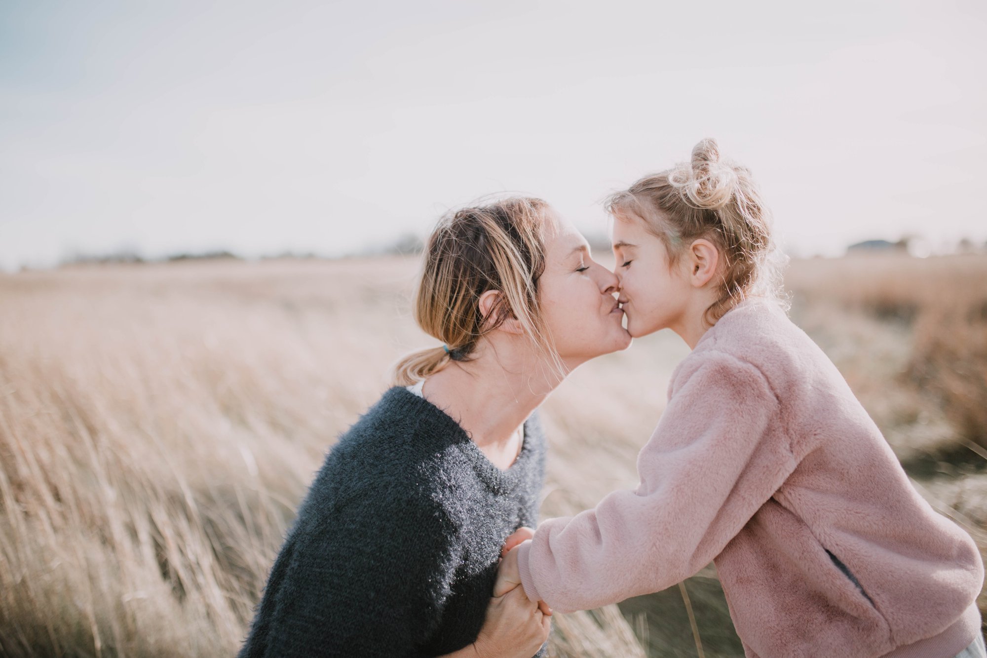 Brendtro family - mom kisses daughter.