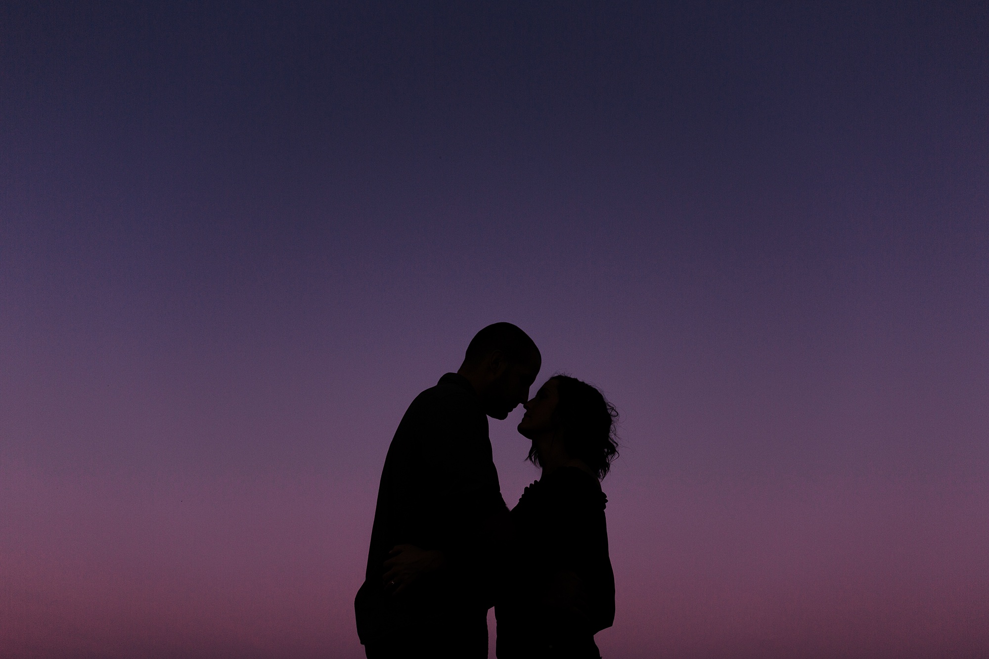 Silhouette of a couple during engagement session.